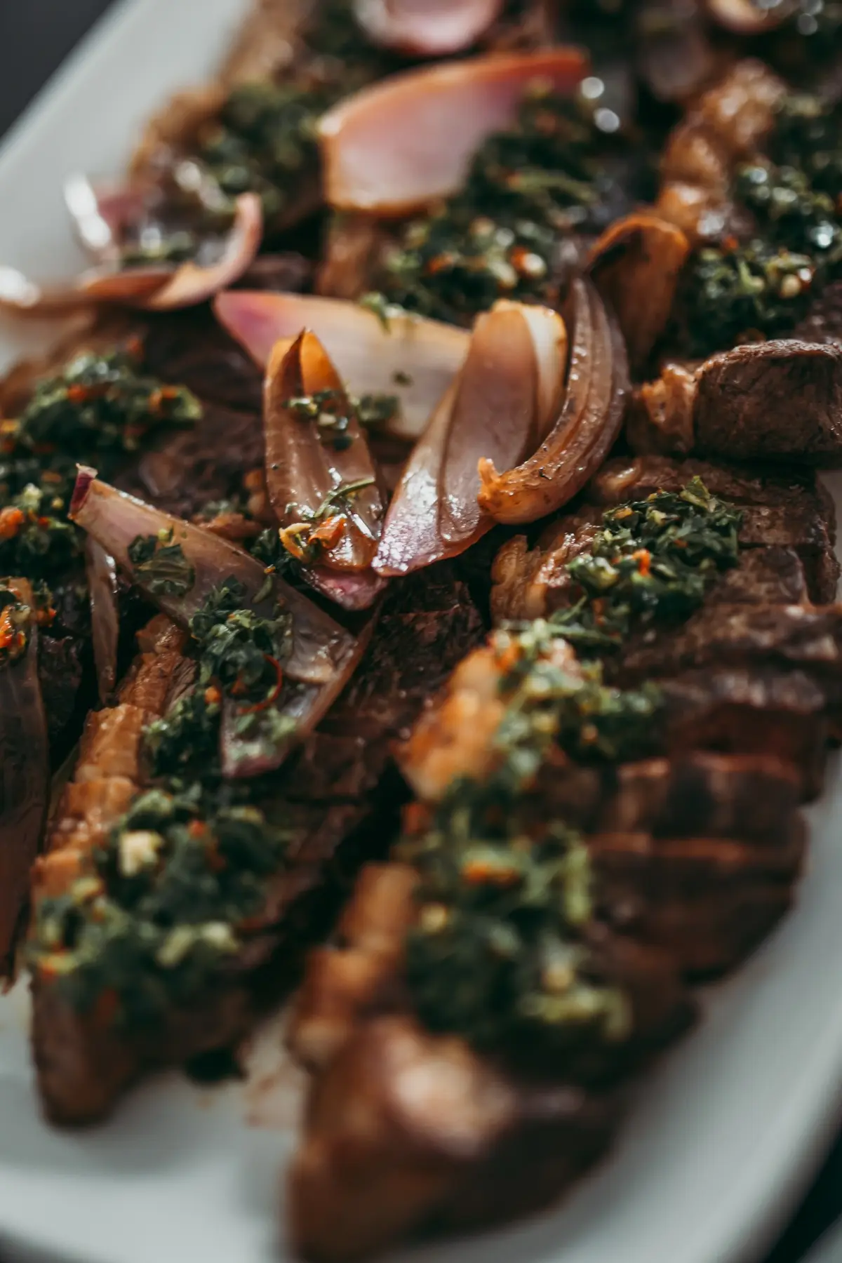 Catered beef with roasted onions and fresh herb sauce